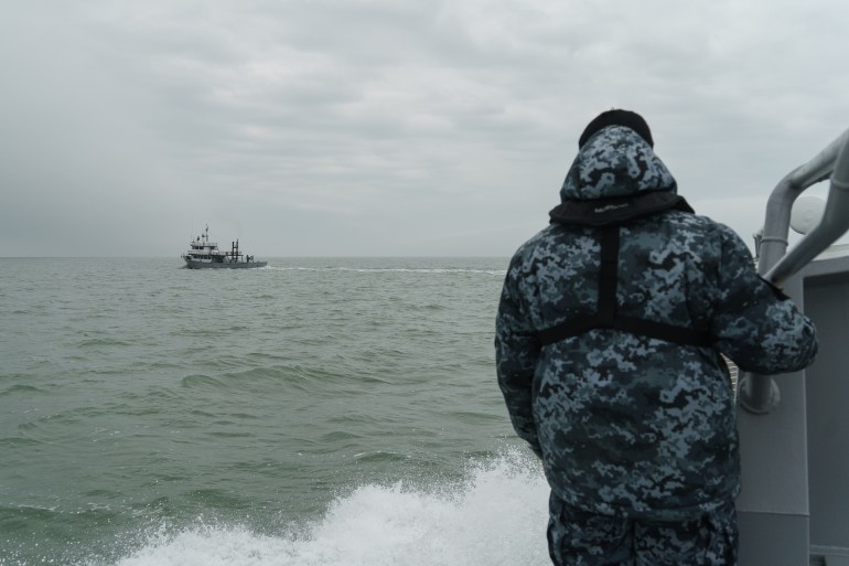 Coast guards patrolling on the Azov sea. Mariupol, Ukraine 2022.