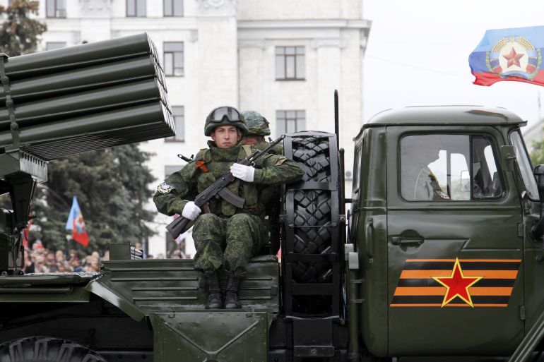 Pro-Russian rebels ride BM-21 'Grad' rocket systems during the military parade in downtown Donetsk, Ukraine