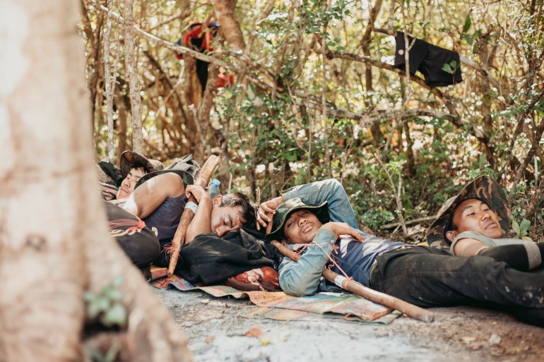 A group of resistance fighters nap between training sessions in eastern Myanmar’s Kayah State.