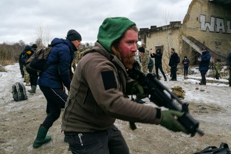 Ukrainian civilians train to become part of territorial defence outside Kyiv, Ukraine [Mansur Mirovalev/Al Jazeera]