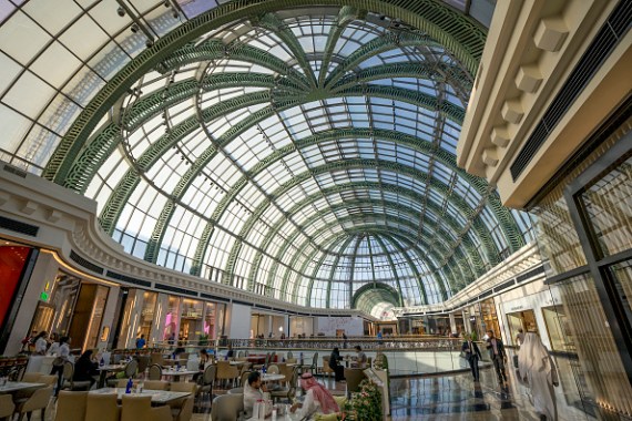 Leisurely deals are conducted while businessmen and Arabs in flowing robes are a regular feature in Dubai's majestic Mall of the Emirates.
