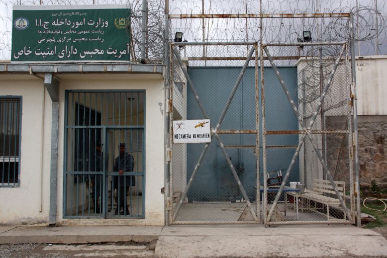 Afghan policemen stand guard at Pul-e-Charkhi prison