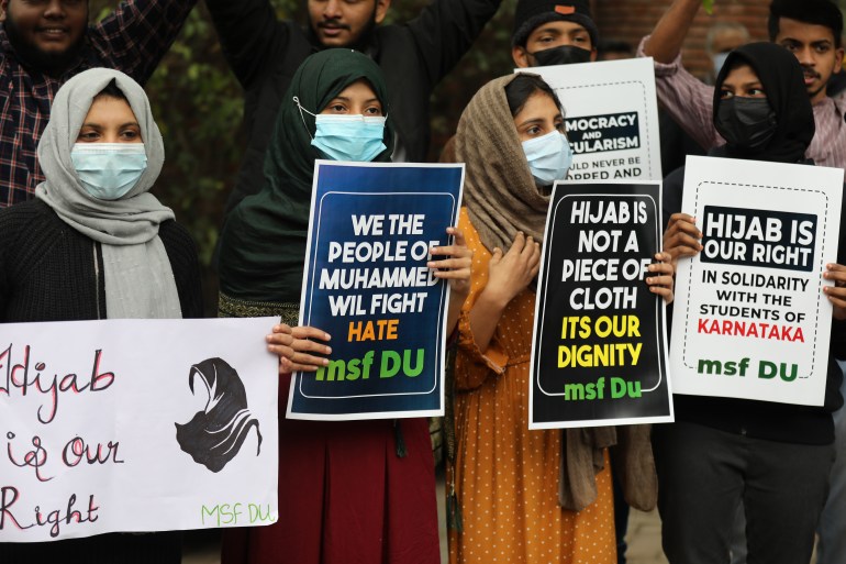 Indian student activists from Muslim Students Federation (MSF) hold placards during a protest against hijab restriction, in New Delhi
