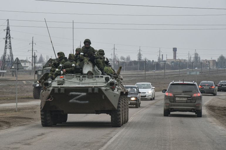 ussian troops move towards Ukraine on the road near Armiansk, Crimea