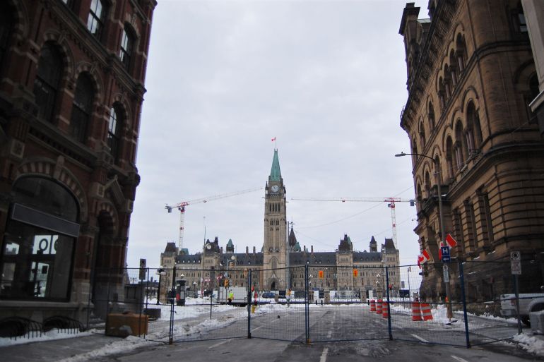 Metal fences stand in front of Canada's parliament