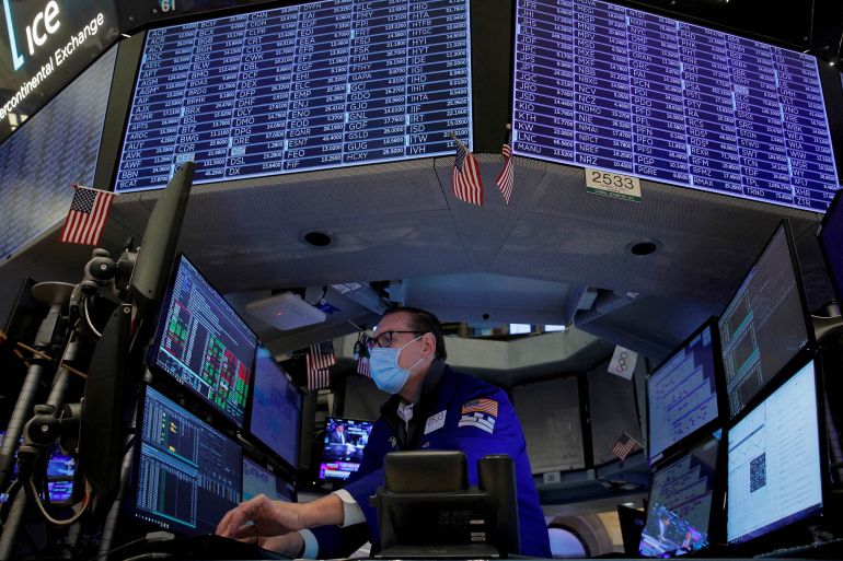 Traders work on the floor of the New York Stock Exchange (NYSE) in New York City, United States