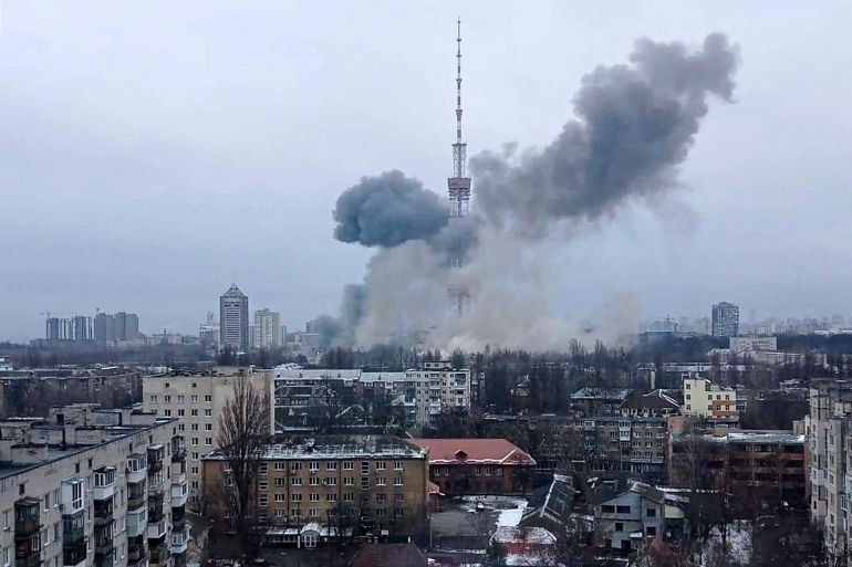 Smoke is seen billowing from near a television tower in Kyiv