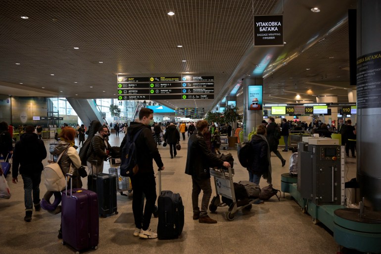 Passengers are seen at Moscow's Domodedovo Airport - the base of Russian carrier S7 - on March 5, 2022, the day S7 Airlines cancelled all its international flights due to sanctions imposed on Russia over the country's invasion of Ukraine.
