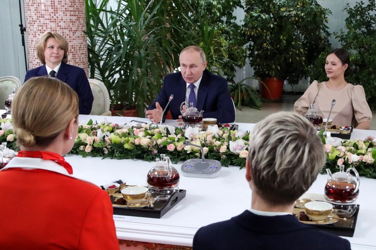 Russian President Vladimir Putin (C) speaks during his meeting with Aeroflot employees outside Moscow on March 5, 2022. - Russian President Vladimir Putin said Saturday that any country that sought to impose a no-fly zone over Ukraine would be considered by Moscow to have entered the conflict