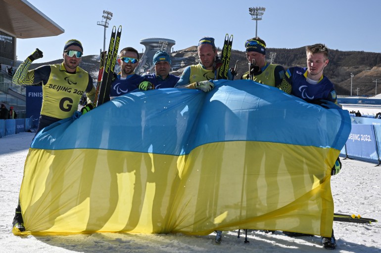 Members of Ukraine's paralympic team are seen celebrating