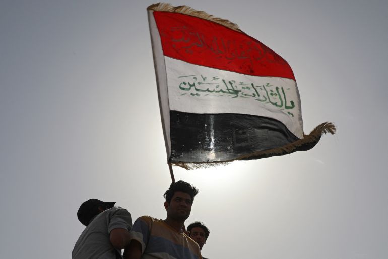 Iraqis demonstrate to denounce rising prices of basic food items, in al-Haboubi Square in the centre of Iraq's city of Nasiriyah in the southern Dhi Qar province on March 9, 2022