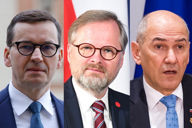 Polish Prime Minister Mateusz Morawiecki (L), Czech counterpart Petr Fiala (C) and Slovenia’s Janez Jansa