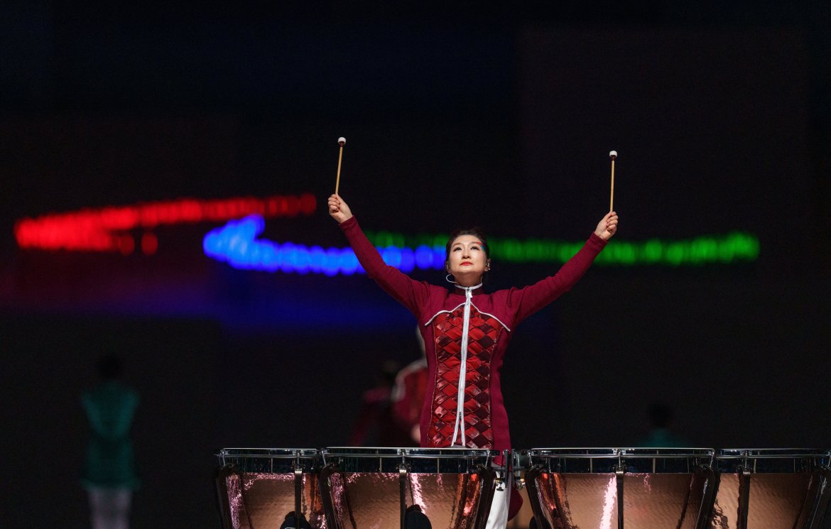 This handout photo taken and received from the OIS/IOC on March 13, 2022 shows a drummer performing in front of the Paralympic symbol "The Three Agitos" during the closing ceremony of the Beijing 2022 Winter Paralympic Games