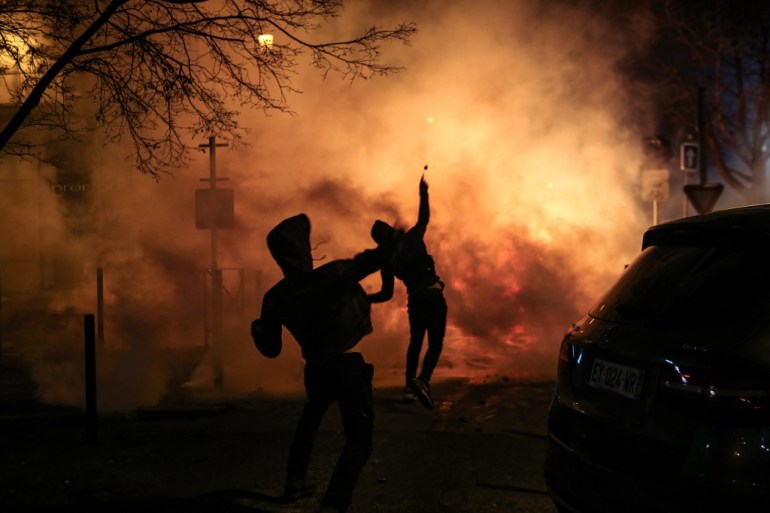 Protesters throws projectiles during clashes with police