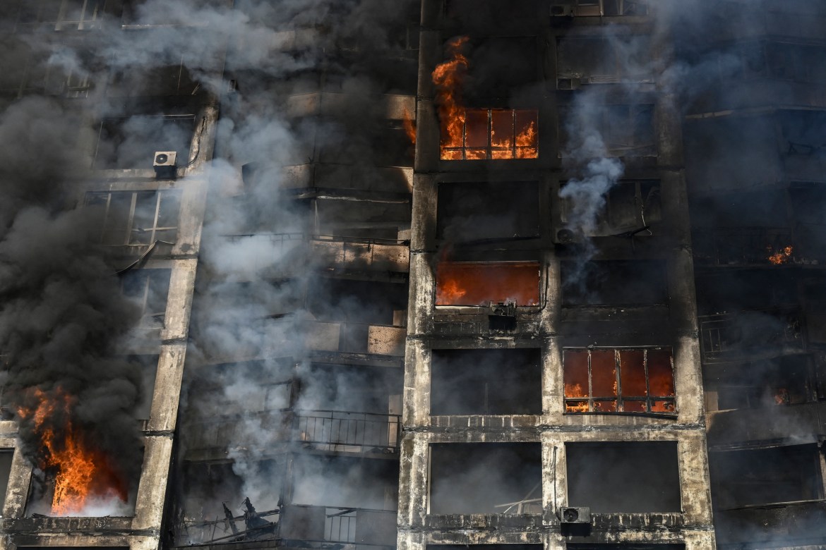 Firefighters extinguish a fire in an apartment building in Kyiv on March