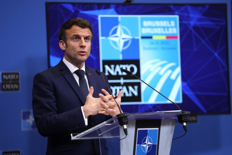 France's President Emmanuel Macron gestures during a press conference at NATO Headquarters in Brussels.