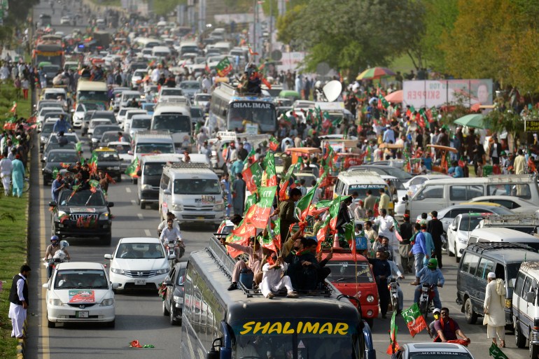 Activists and supporters of ruling Pakistan Tehreek-e-Insaf (PTI) party arrive to attend a rally in Islamabad
