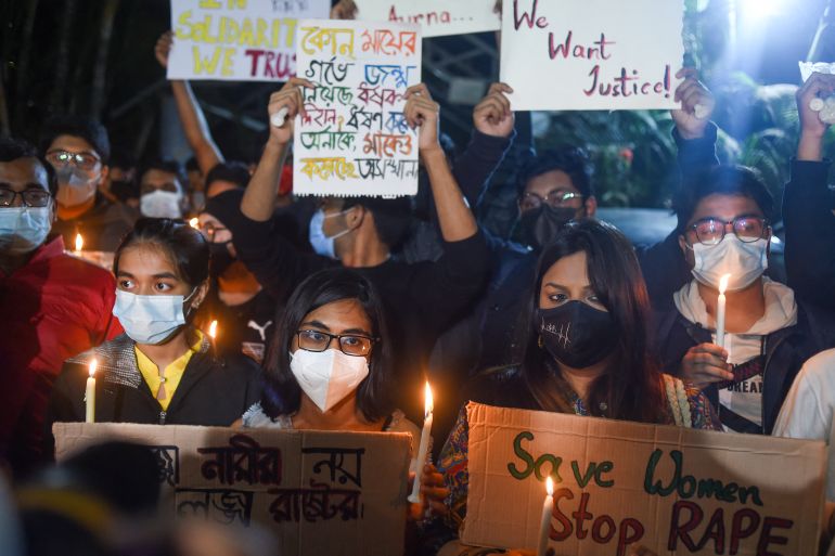 Demonstrators take part in a candlelight vigil demanding justice for a recent rape victim in Dhaka