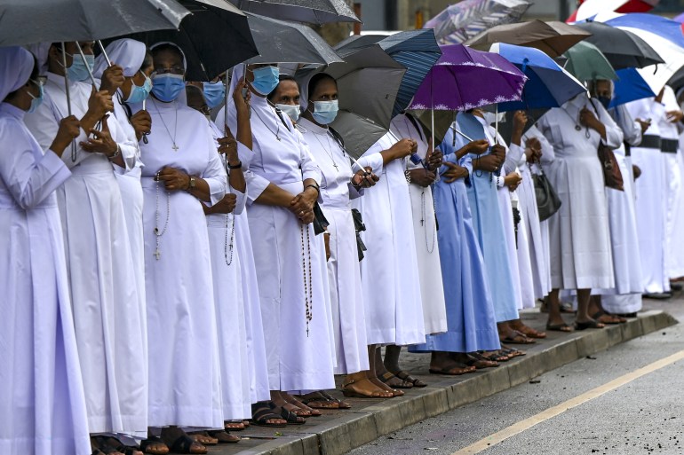 Catholic priests and nuns stage a silent protest outside the Sri Lanka's Supreme Court complex in Colombo