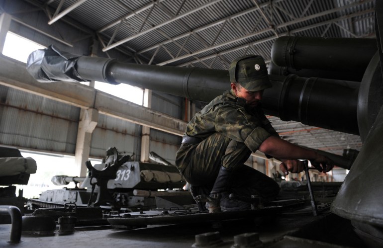 A Russian soldier prepares a self-propelled gun at the Tskhinvali military base on August 7, 2009.