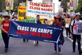 Protesters carrying signs saying 'close the camps', close nauru' and 'close manus' rally in Sydney against Australia's controversial offshore immigration policy