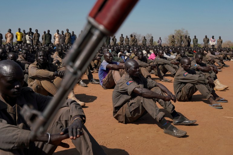 South Sudan People's Defence Forces (SSPDF), South Sudan Opposition Alliance (SSOA), and The Sudan People's Liberation Movement in Opposition (SPLM-IO) soldiers gather at the training site for the joint force to protect VIPs