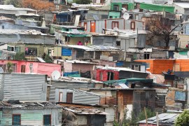 Shacks are seen lined closely together in Kayamandi township near Stellenbosch, South Africa