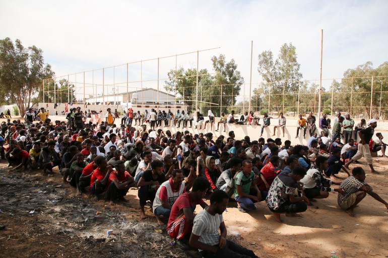 Migrants gather at a detention center at Ain Zara, in Tripoli.