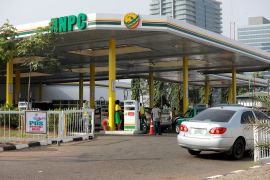 Cars queue to buy petrol at the NNPC Mega petrol station in Abuja, Nigeria March 19, 2020