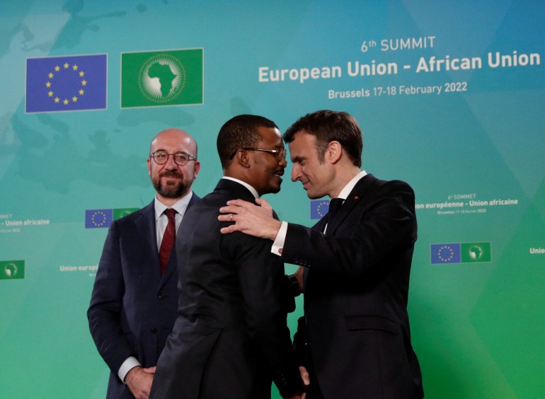 Chad's President Mahamat Idriss Deby is welcomed by French President Emmanuel Macron and European Council President Charles Michel during the European Union - African Union summit in Brussels, Belgium