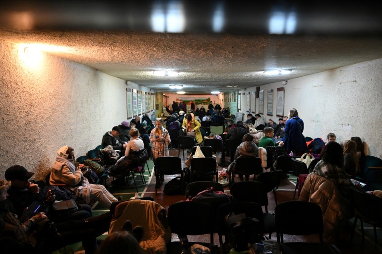 People gather in an air raid shelter in Kyiv, Ukraine February 24, 2022. Picture taken February 24, 2022. 
