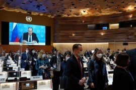 Denmark's Foreign Minister Jeppe Kofod walks out along with other ambassadors and diplomats while Russian Foreign Minister Sergei Lavrov's (on screen) pre-recorded video message is played at the 49th session of the UN Human Rights Council at the European headquarters of the United Nations in Geneva, Switzerland March 1, 2022,