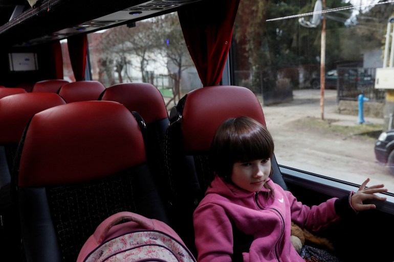 Laura, 8 fleeing from Ukraine without her parents sits on a bus