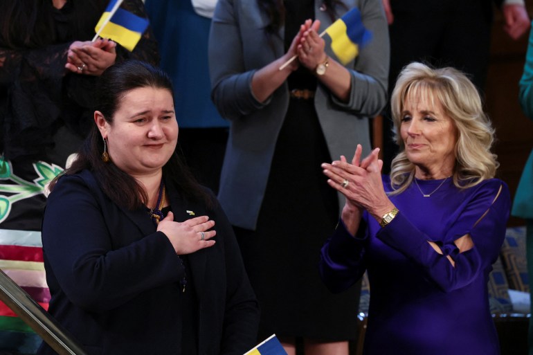 US first lady Jill Biden applauds her guest Ukrainian Ambassador to the US Oksana Markarova in the first lady's box