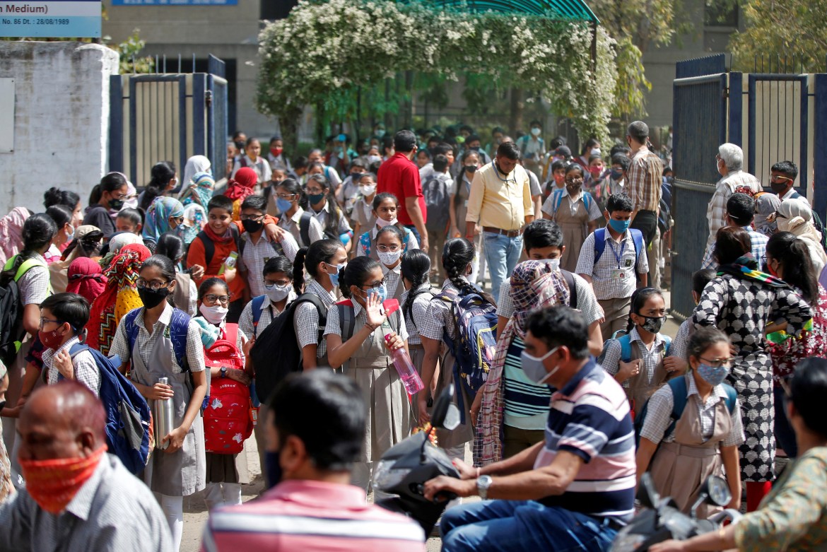 Students leave school after a majority of schools were reopened following their closure due to the coronavirus disease (COVID-19) pandemic, in Ahmedabad,