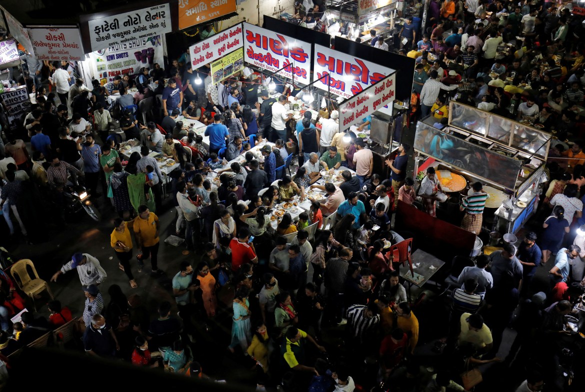 People dine at a food hawker centre at Manek Chowk in Ahmedabad