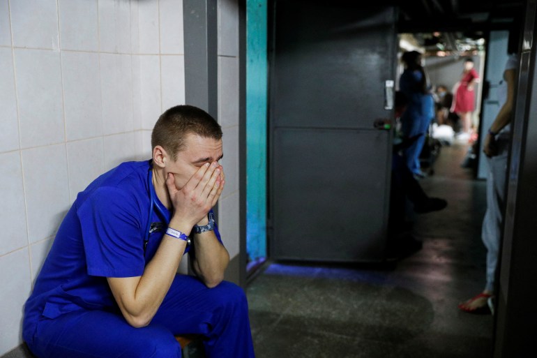 A doctor is seen taking shelter in a basement in Kyiv