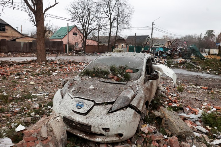 A destroyed car is seen in Irpin, Ukraine