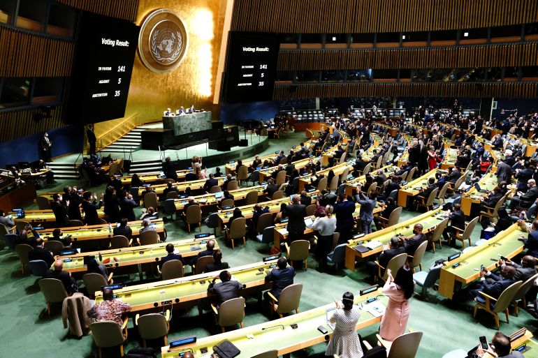 UN Delegates react as results of the voting are displayed during the 11th emergency special session of the 193-member U.N. General Assembly on Russia's invasion of Ukraine,