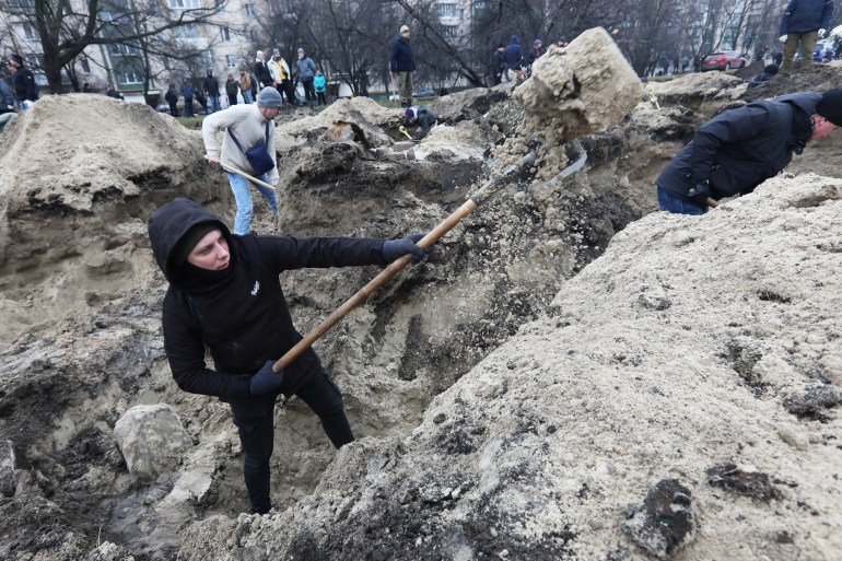 Volunteers dig trenches in Ukrainian capital, Kyiv