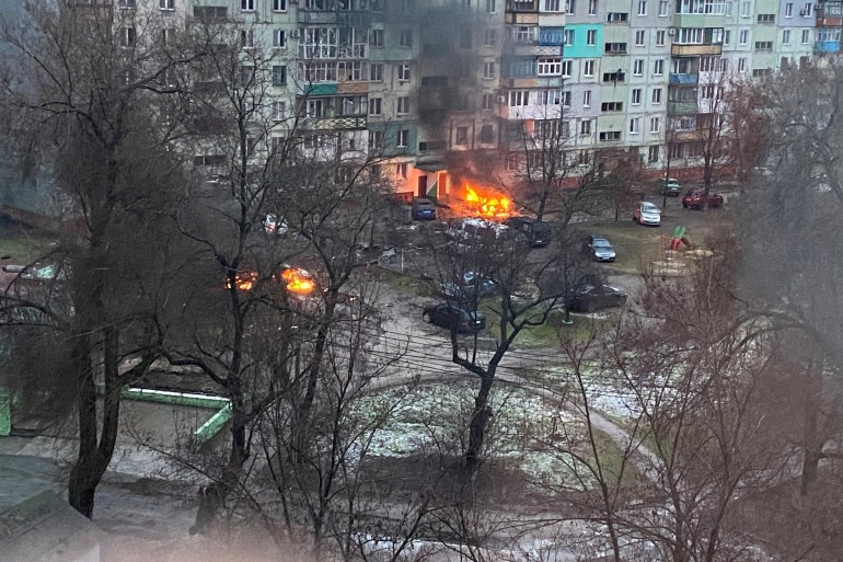 Fire is seen in Mariupol at a residential area after shelling amid Russia's invasion of Ukraine