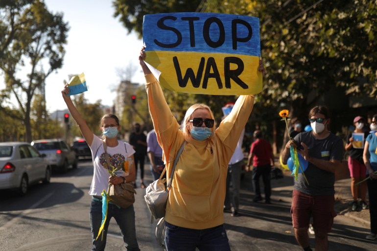 A woman takes part in an anti-war protest in front of the Russian embassy in Chile.