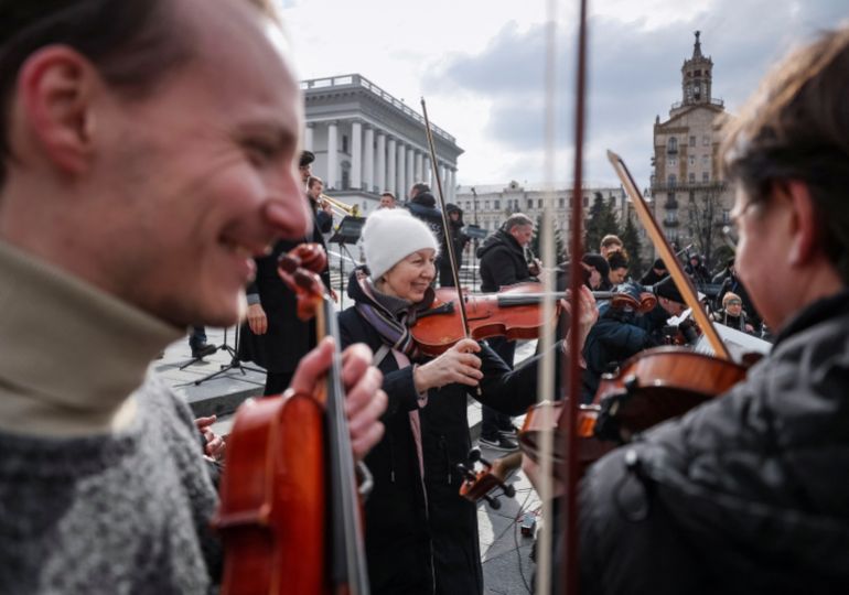 Musicians of the Kyiv-Classic Symphony Orchestra are seen playing in Kyiv