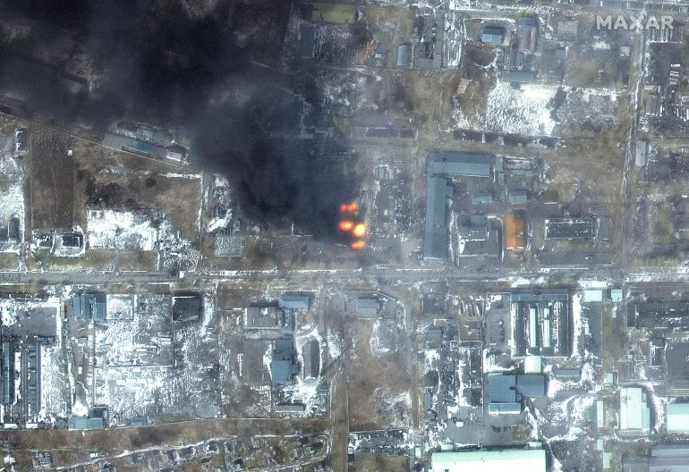 A satellite image shows a panoramic view of a fire at an industrial area, to the west of Mariupol, Ukraine