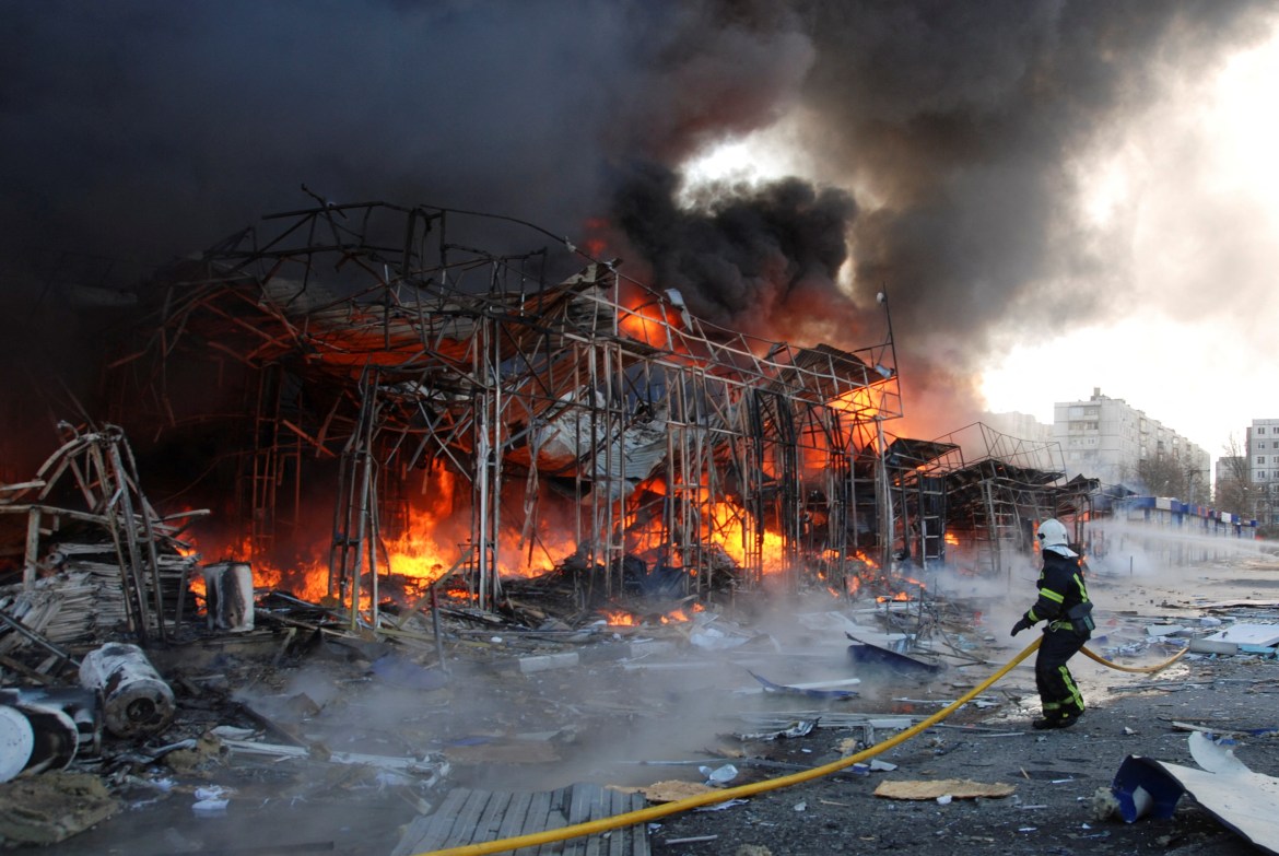 A firefighter works at a site of a fire, as Russia's invasion of Ukraine continues, in Kharkiv,