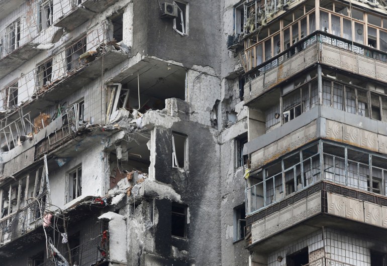   A view shows a residential building which was damaged during the Ukraine-Russia conflict in the besieged southern port city of Mariupol, Ukraine March 18, 2022. 