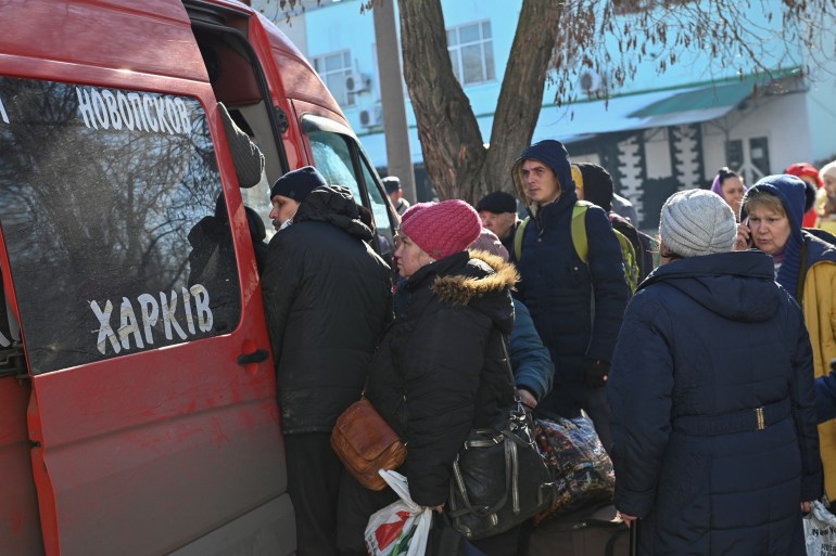 People are seen attempting to flee Ukraine's Luhasnk region via bus