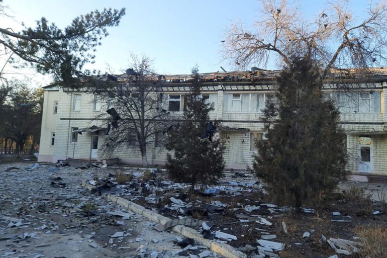 A bombed out hospital in Sievierodonetsk with rubble strewn on the ground in front,