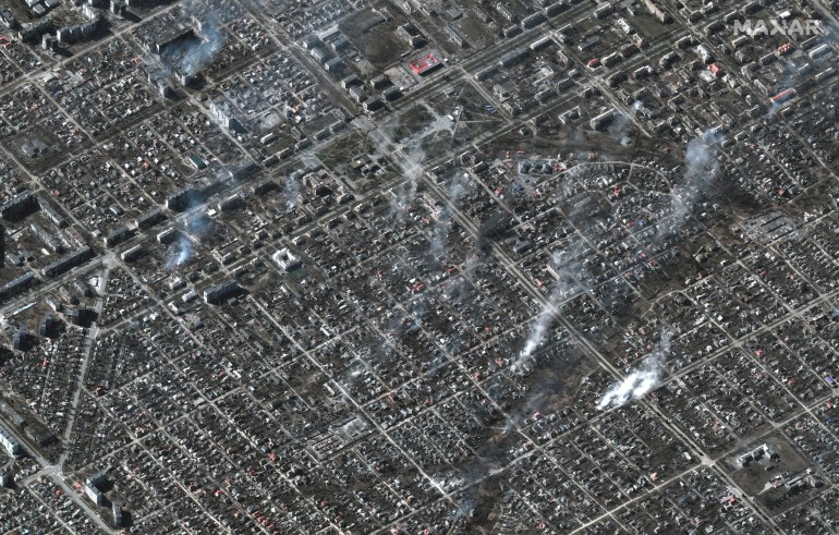 A satellite image shows an overview of burning buildings in Livoberezhnyi district, Mariupol, Ukraine, March 22, 2022. 