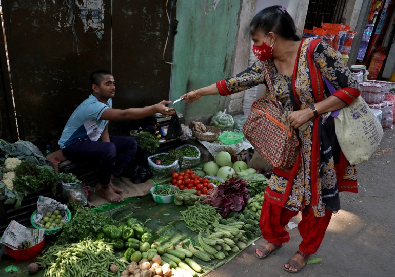 Vendedor de verduras en la carretera en Calcuta